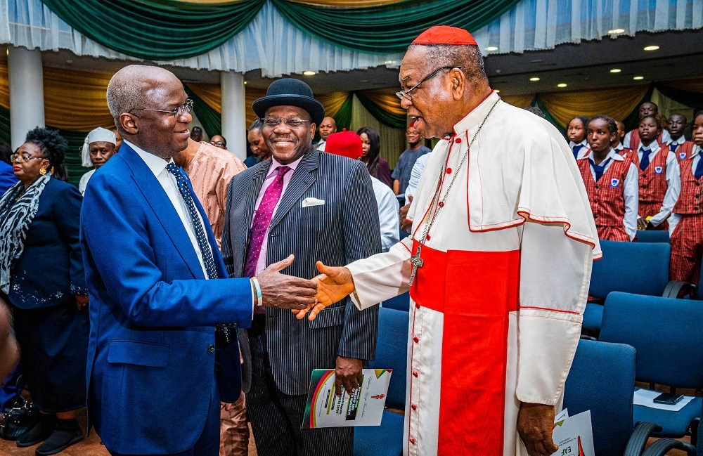 Hon. Minister of Works and Housing and Guest Speaker,  Mr Babatunde Fashola, SAN (left), former Permanent Secretary and Book Reviewer, Ambassador Godknows Igali (middle) and  Archbishop Emeritus, Abuja Archdiocese and Book Presenter, John Cardinal Onaiyekan (right) during the Epiphany Azinge Foundation 2022 Annual Lecture with the theme,&quot; Leadership and Service to Humanity&quot; and public presentation of Biography titled, &quot; Azinge: Born to Serve&quot; at the Shehu Musa Yar&#039;Adua Centre, Abuja on Tuesday, 15th November 2022.