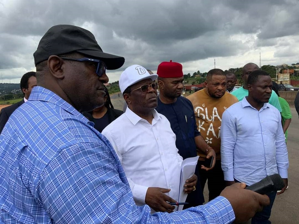 Honourable Minister, Federal Ministry of Works, Senator Dave Umahi, Director, Highways South East, Engr B. U. Obioha and members of the press at the inspection of the Rehabilitation of Outstanding Section of Enugu-Onitsha Expressway in Anambra & Enugu States under the Road Infrastructure Tax Credit Scheme (RITCS)