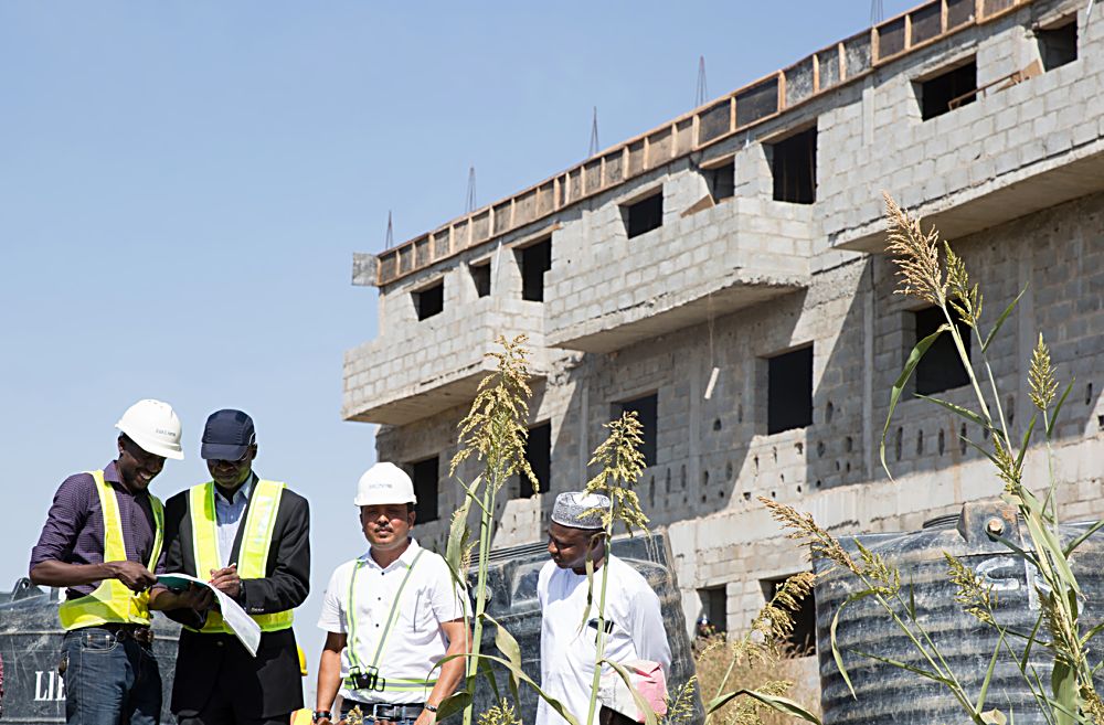 Hon.Minister of Power, Works & Housing, Mr Babatunde Fashola, SAN (2nd left ),Director in the Ministry, Arch. Gidado Sani(right), Project Manager Brains & Hammers, Mr Tasiu Umar(left) and Manager Technical Operations, Brains & Hammers Limited, Engr. Madhur Tripathi (2nd right) during the Minister's inspection of the Brains & Hammers Estate in Life Camp, Abuja on Thursday 1st December 2016. 