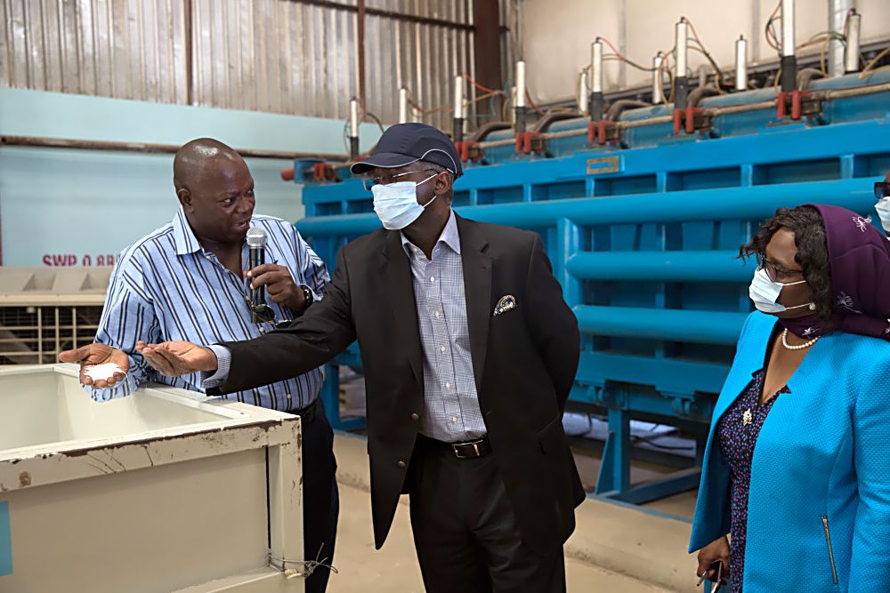 Hon.Minister of Power, Works & Housing, Mr Babatunde Fashola, SAN (middle), Director, Public Private Partnership, Housing Sector in the Ministry, Arch.(Mrs) Eucharia Alozie(right) and MD/CEO, Citec International Estates Limited, Mr Oludare Bello(left) during the Minister's inspection tour of the production facility for Polysterene technology and other building material components  in Life Camp, Abuja on Thursday 1st December, 2016. 