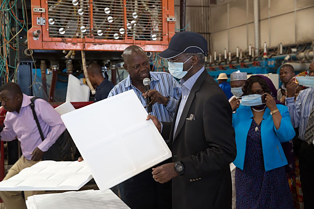 Hon.Minister of Power, Works & Housing, Mr Babatunde Fashola, SAN (middle), Director, Public Private Partnership, Housing Sector in the Ministry, Arch.(Mrs) Eucharia Alozie(right) and MD/CEO, Citec International Estates Limited, Mr Oludare Bello(left) during the Minister's inspection tour of the production facility for Polysterene technology and other building material components  in Life Camp, Abuja on Thursday 1st December, 2016. 