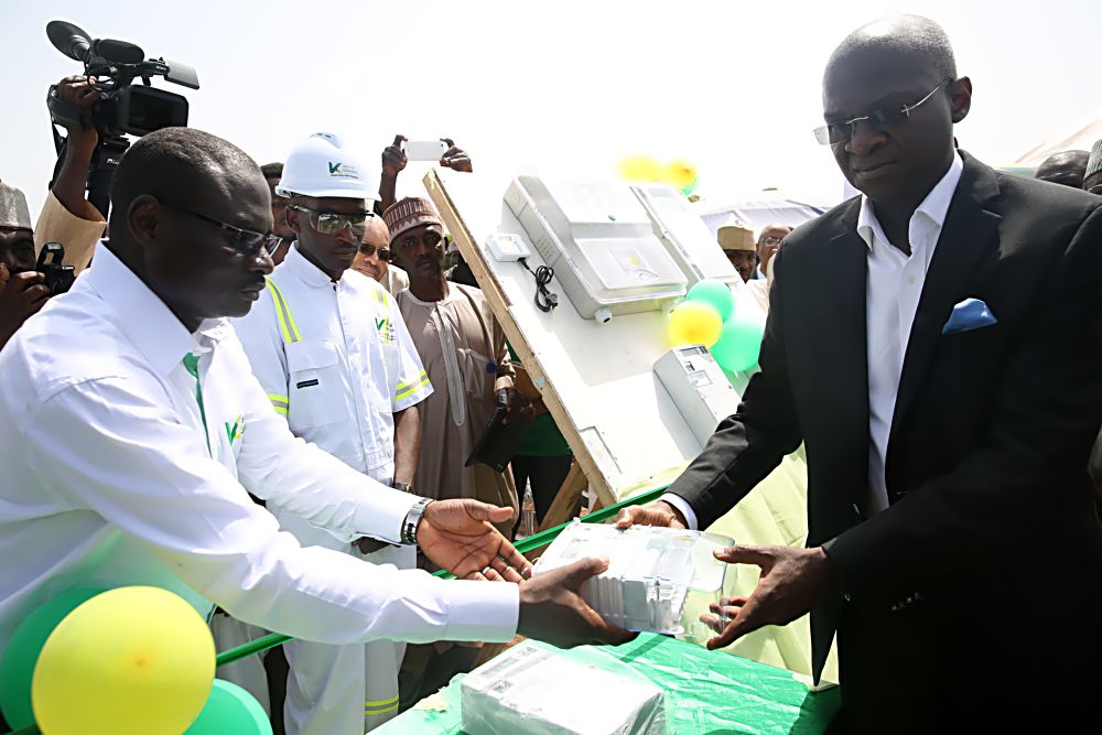 Hon Minister of Power, Works & Housing, Mr Babatunde Fashola,SAN(right) handing over one of the split â€“ type meter to the personnel of the Kaduna Electricity Distribution Company shortly after the kick off of the Mass Meter Deployment  by the Kaduna DisCo in Sokoto held at the premises of the Sokoto Independent Power Plant, Sokoto State on Monday 10th October 2016