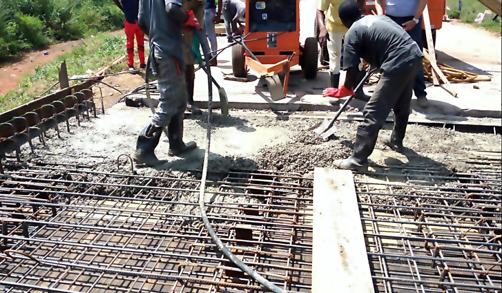 Personnel of Borini Prono & Co (Nigeria) Limited casting concrete during the emergency repair works on the collapsed deck slab of Jaji Bridge along Kaduna - Zaria road commissioned by the Federal Ministry of Power, Works and Housing in Kaduna State recently.Â 