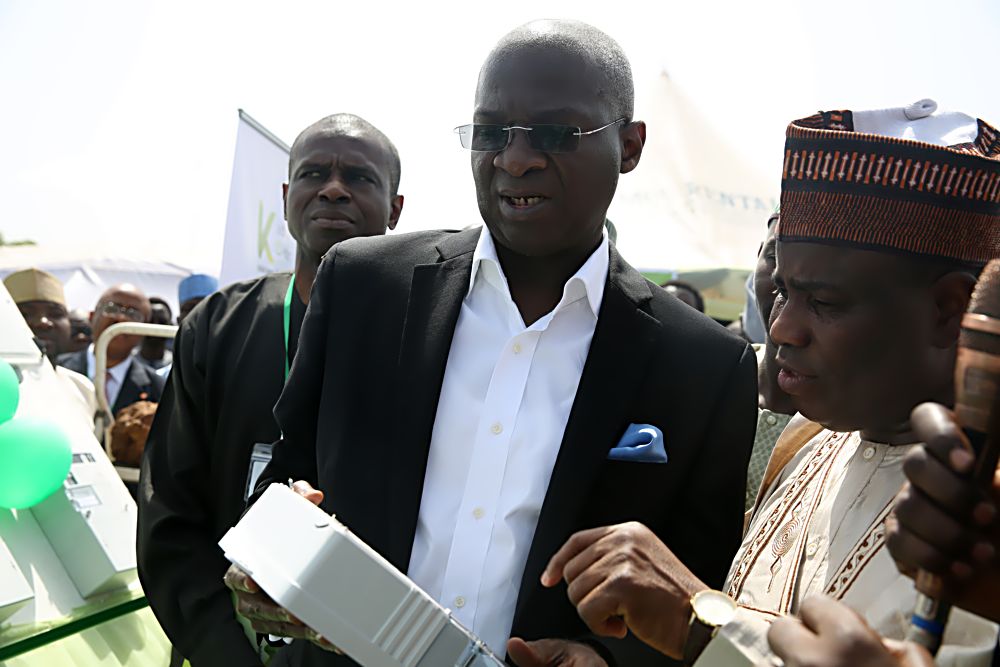 Hon Minister of Power, Works & Housing, Mr Babatunde Fashola,SAN(left) and Governor of Sokoto State, Rt. Hon. Aminu Tambuwal(right) inspect one of the split-type meters at the launching of the Mass Meter Deployment by the Kaduna Electricity Distribution Company in Sokoto held at the premises of the Sokoto Independent Power Plant, Sokoto State on Monday 10th October 2016