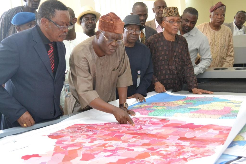 Honourable Minister of State viewing a distribution map